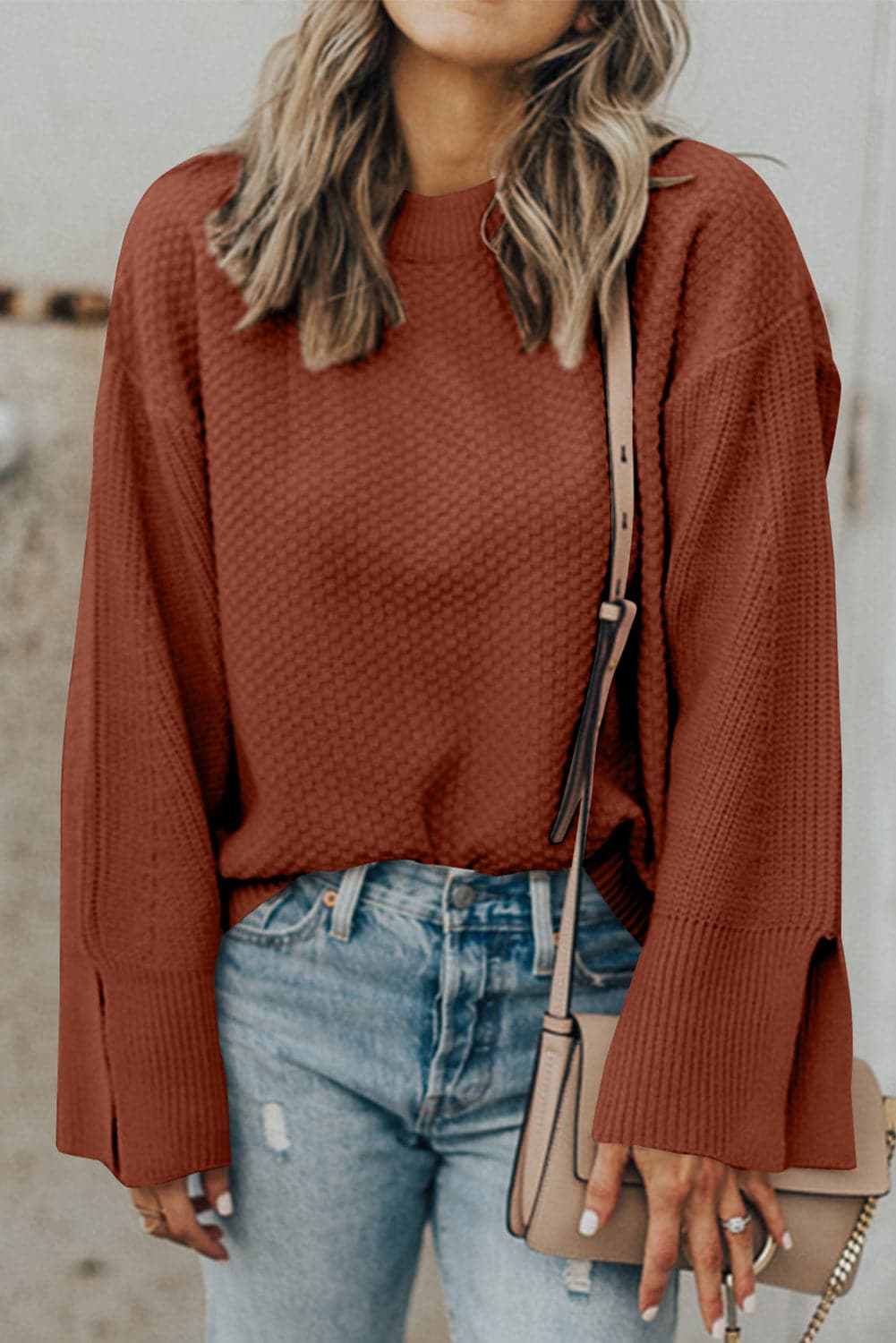 Chic textured long sleeve sweater with stylish slit detail