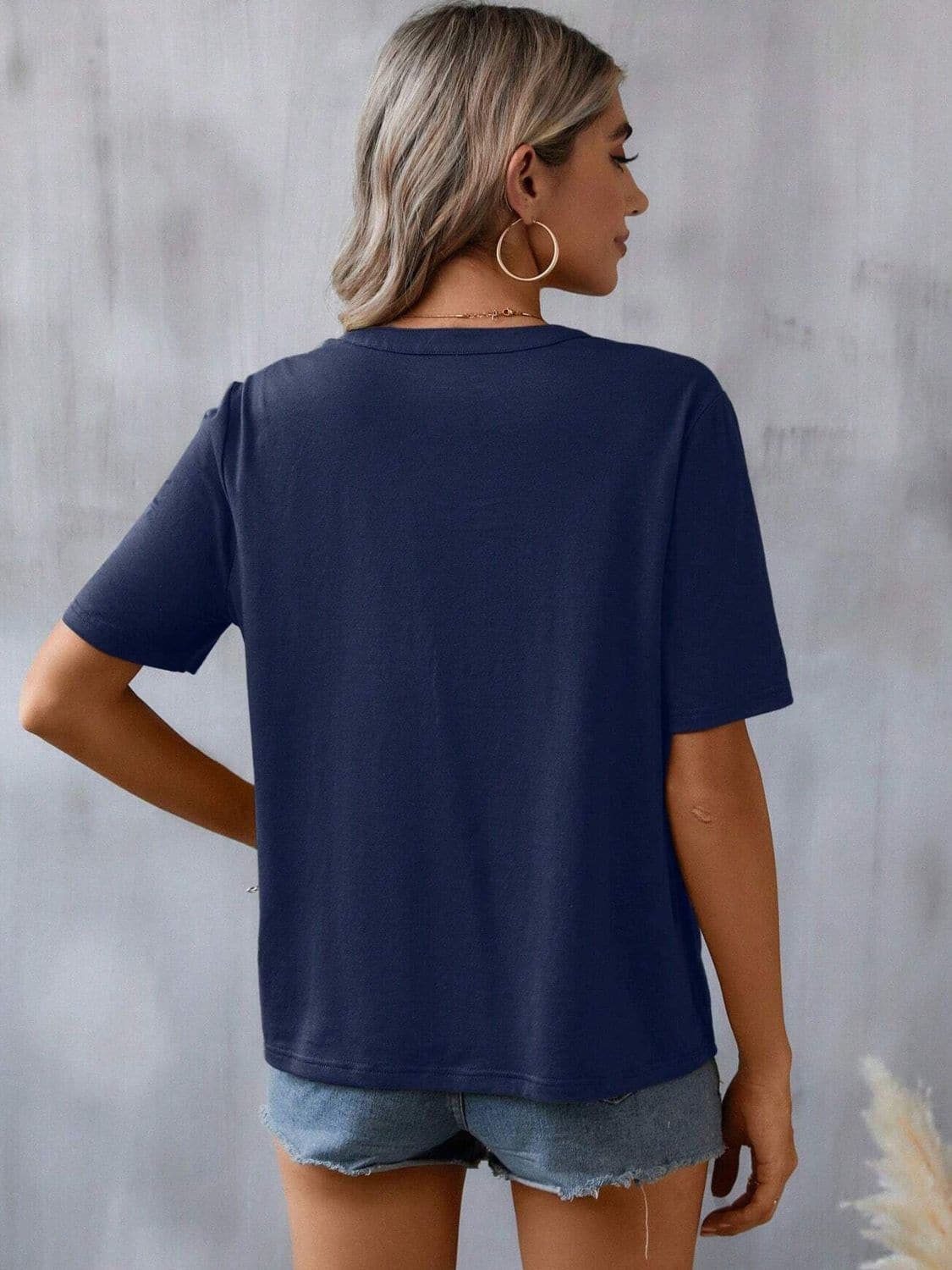 Embroidered Notched Short Sleeve T-Shirt.