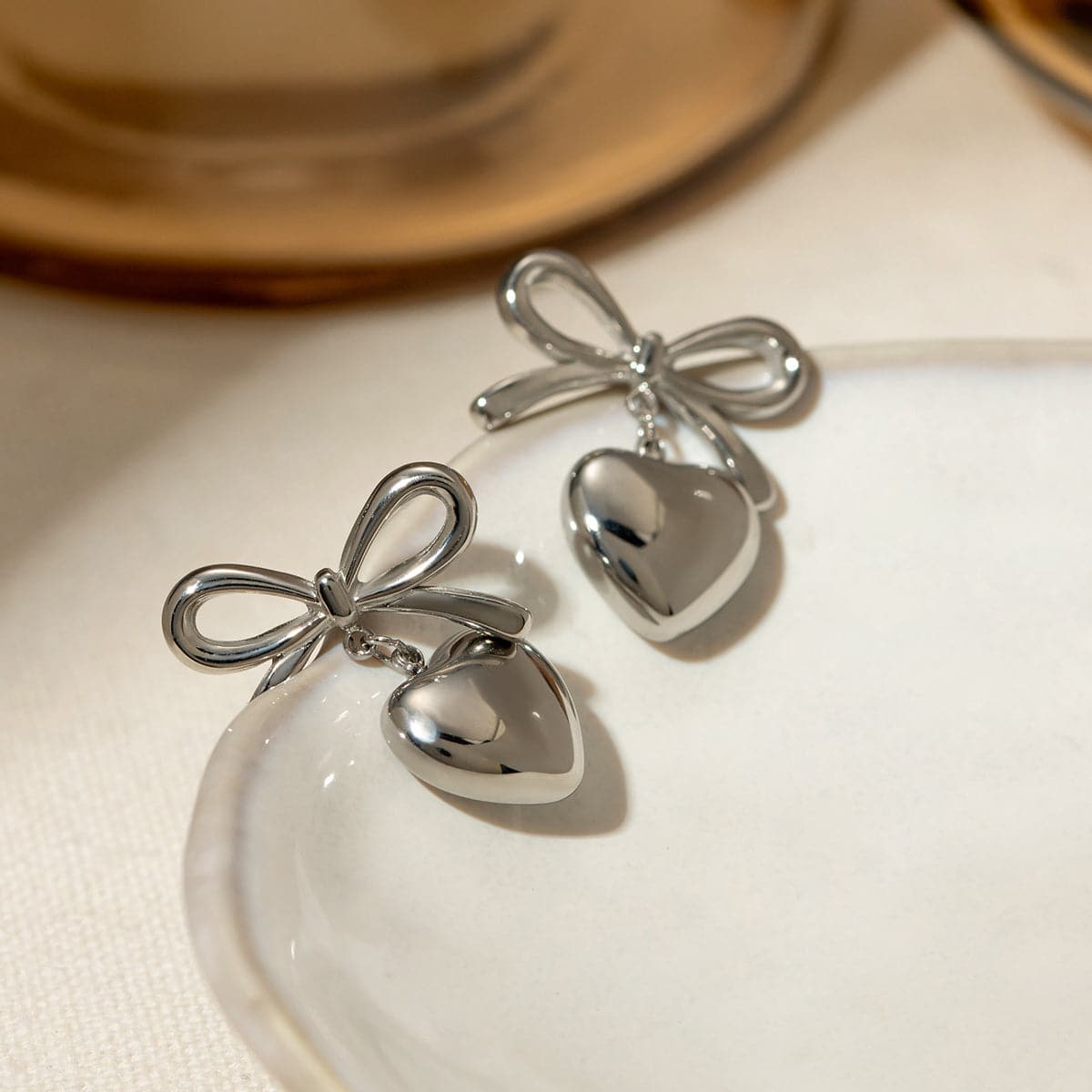 Stainless Steel Bow & Heart Drop Earrings.