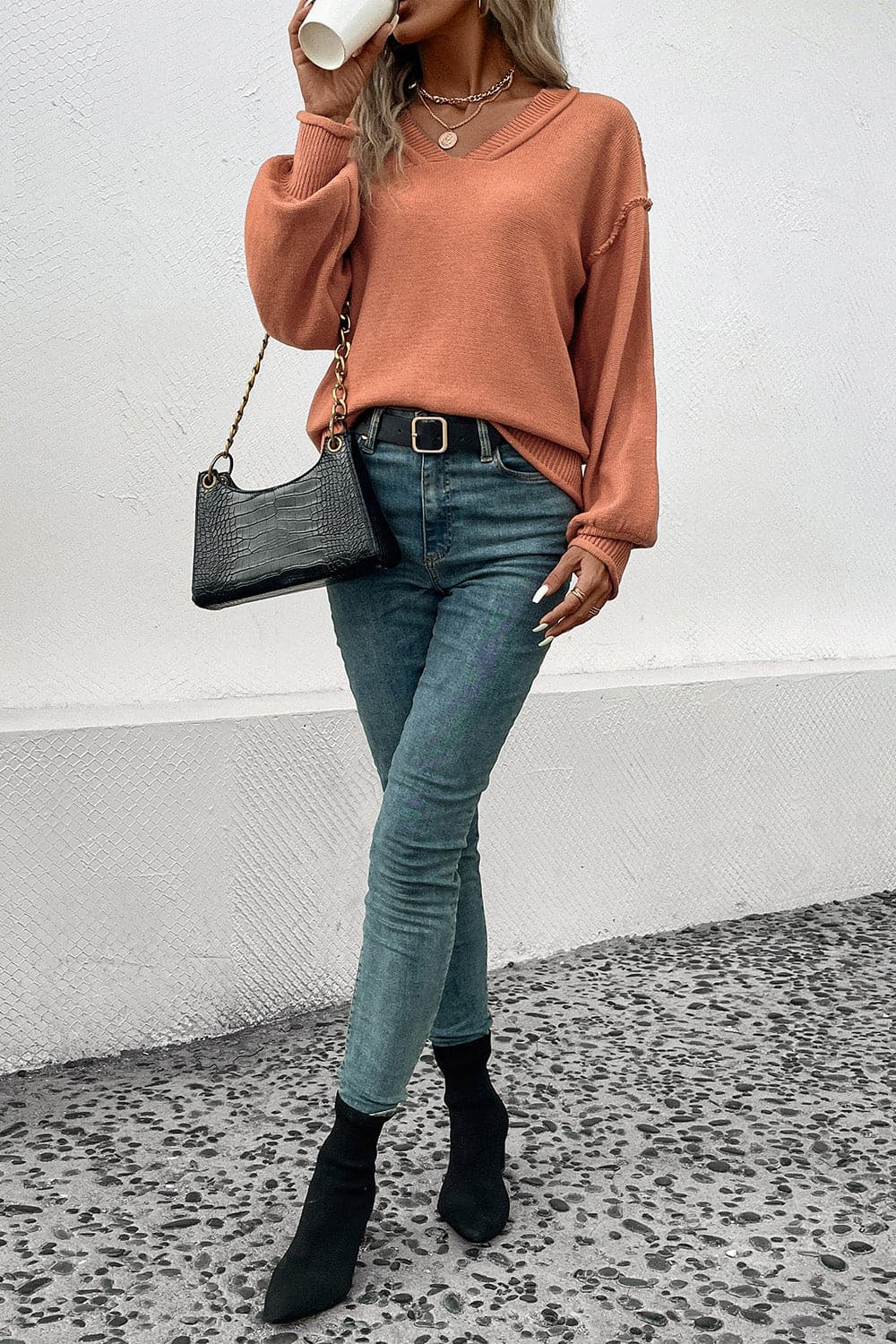 V-Neck Exposed Seam Sweater.