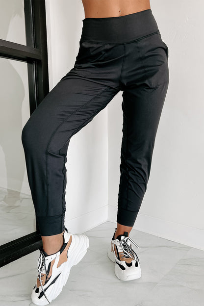 Modern high-waisted joggers with exposed seams and pockets