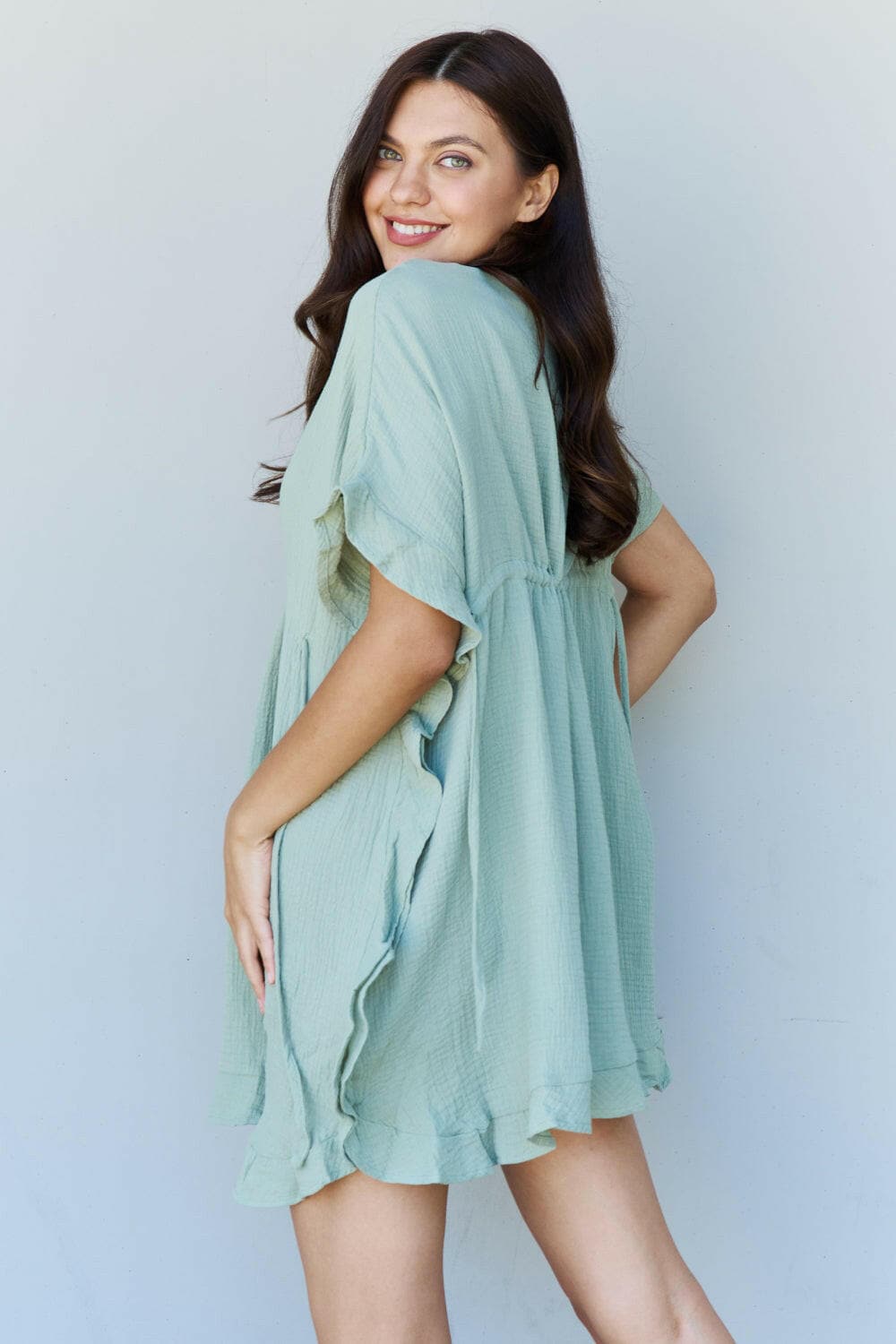 Ninexis Out Of Time Full Size Ruffle Hem Dress with Drawstring WaistbaExperience Effortless Elegance with the Ninexis Out Of Time Full Size Ruffle Hem Dress in Light Sage. This stunning dress is crafted from 100% cotton, providing a soLove Salve Time Full Size Ruffle Hem DressTIKTOK