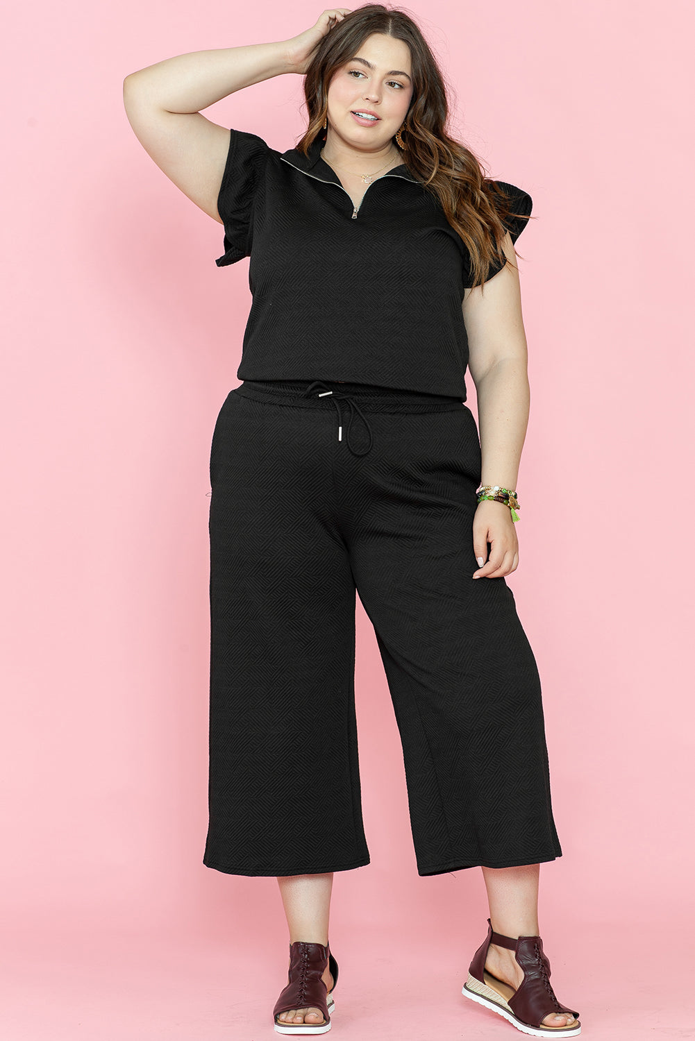 Chic black plus size ruffled sleeve quarter zip top and wide-leg pants set