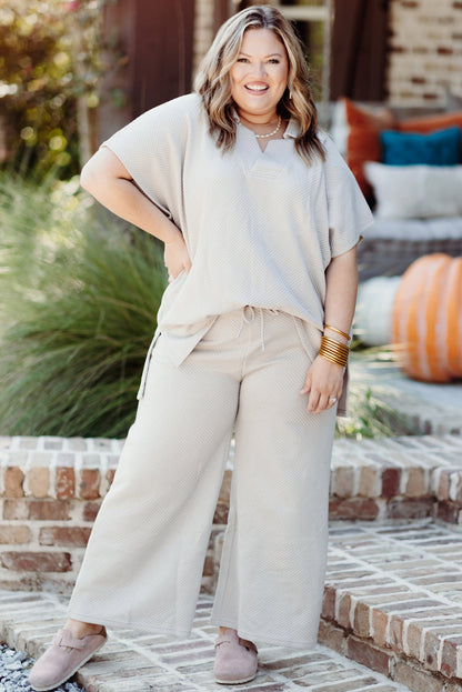 Chic beige plus size textured top and pants ensemble