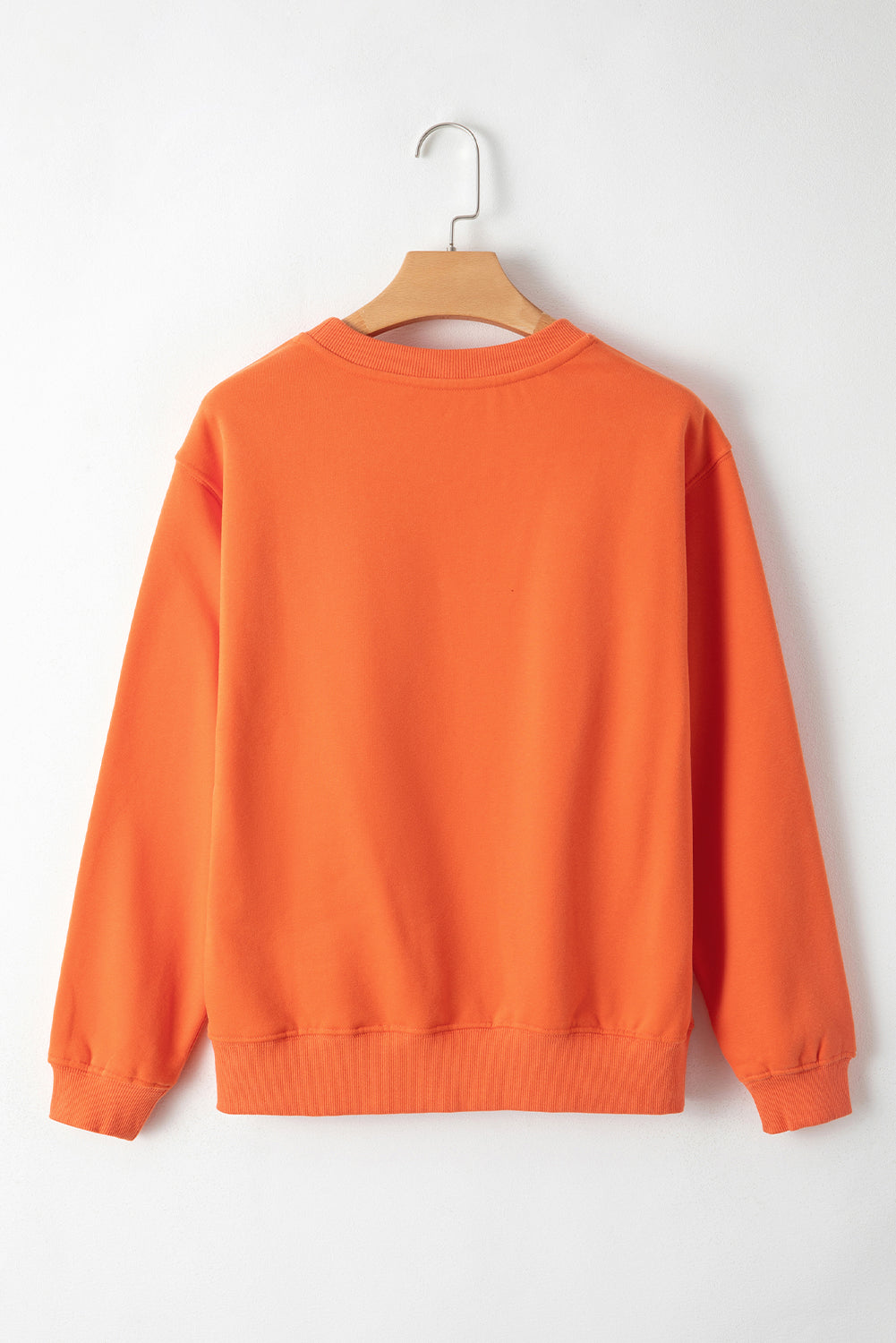 Cozy russet orange fleece-lined sweatshirt with drop shoulders