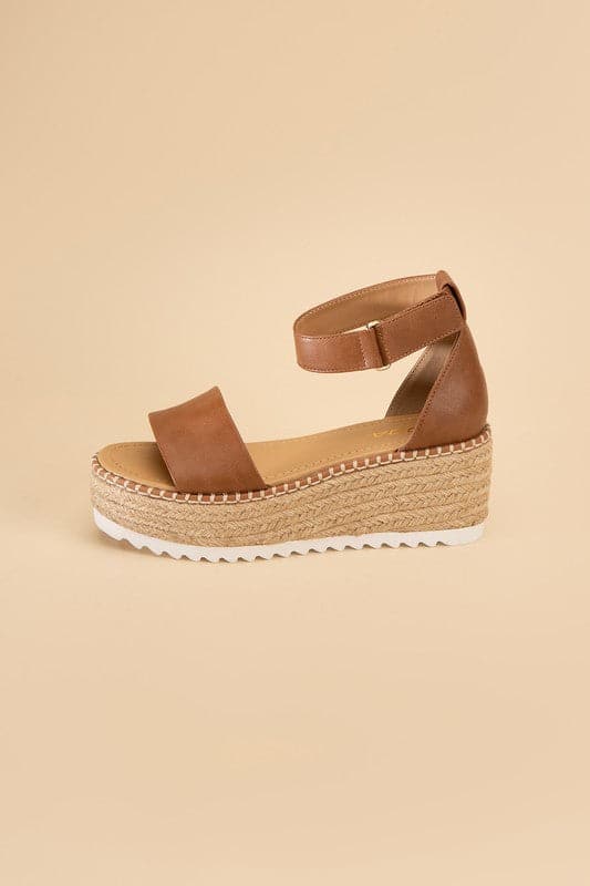 TUCKIN-S Platform Sandals.