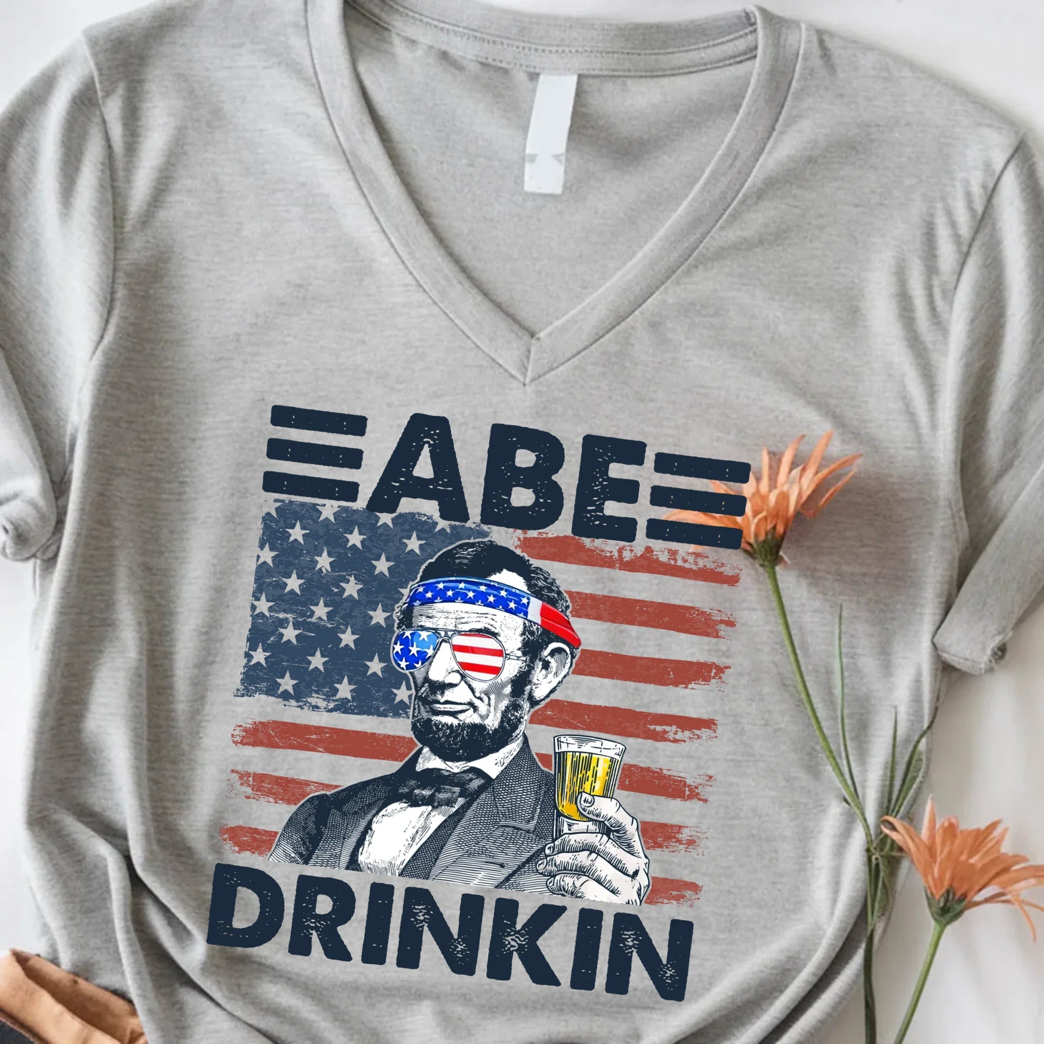 Abe Drinkin 4th of July Unisex V-Neck Shirt – Abraham Lincoln Patriotic Drinking Tee - Product detail view T-Shirt by Ador...