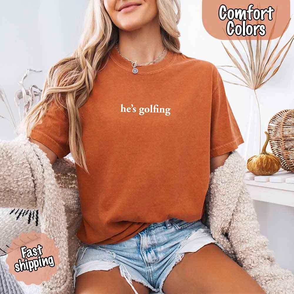 Adorb Custom Tees He's Golfing Comfort Colors shirt, a unique and comfortable tee, perfect for expressing a fun personality.