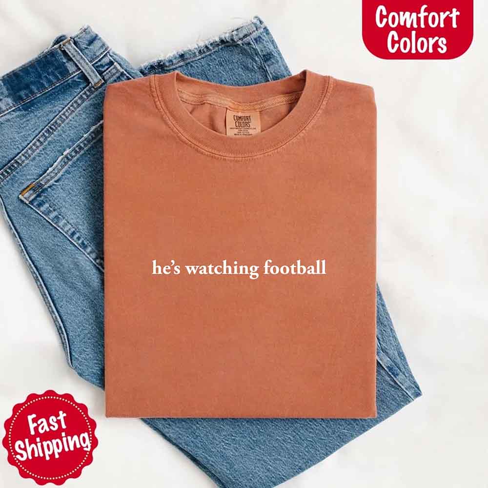 He’s Watching Football Tee - Comfort Colors Funny Shirt for Her Adorb Custom Tees