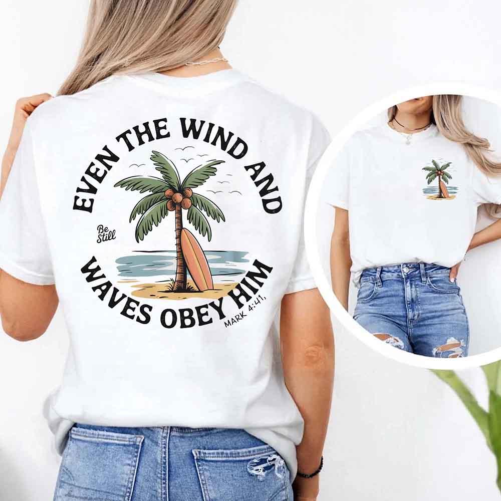 Adorb.co Even the Wind Obey Him Tee, a comfortable unisex Christian shirt, highlighting the full inspirational graphic.