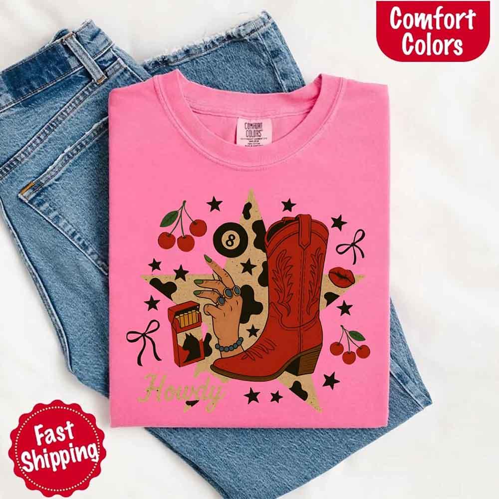 Adorb.co Howdy Cowgirl Star Collage Comfort Shirt neatly folded, displaying the full unique design and vibrant color.