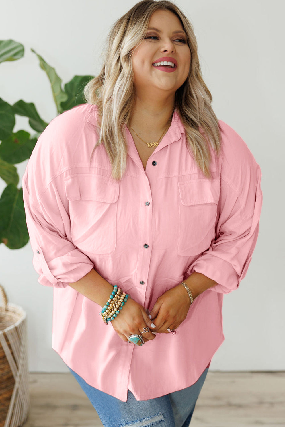 Chic pink plus size button-down shirt with flap pockets and roll-tab sleeves