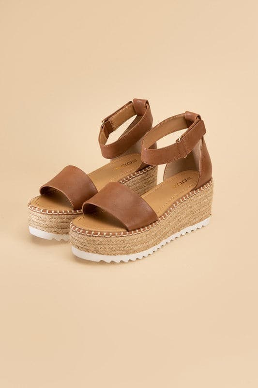 TUCKIN-S Platform Sandals.