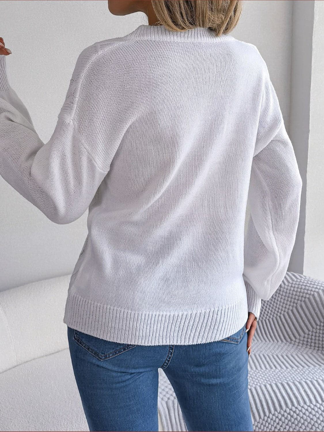 Cable-Knit Buttoned V-Neck Sweater.