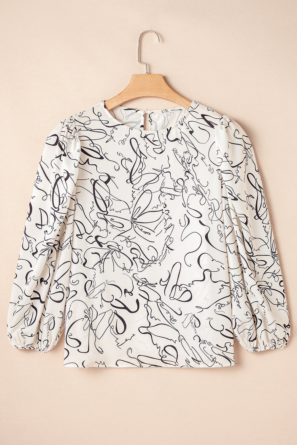 Chic beige abstract print blouse with balloon sleeves and crew neck