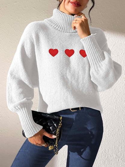 Charming heart-patterned turtleneck sweater with long sleeves