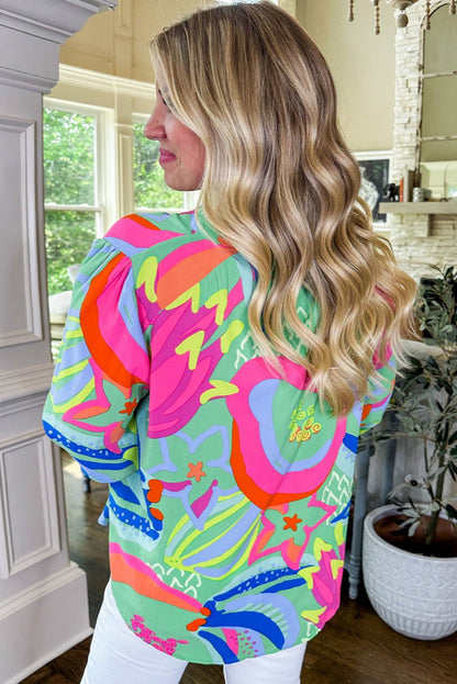 Flattering green abstract print plus size blouse with flounce sleeves