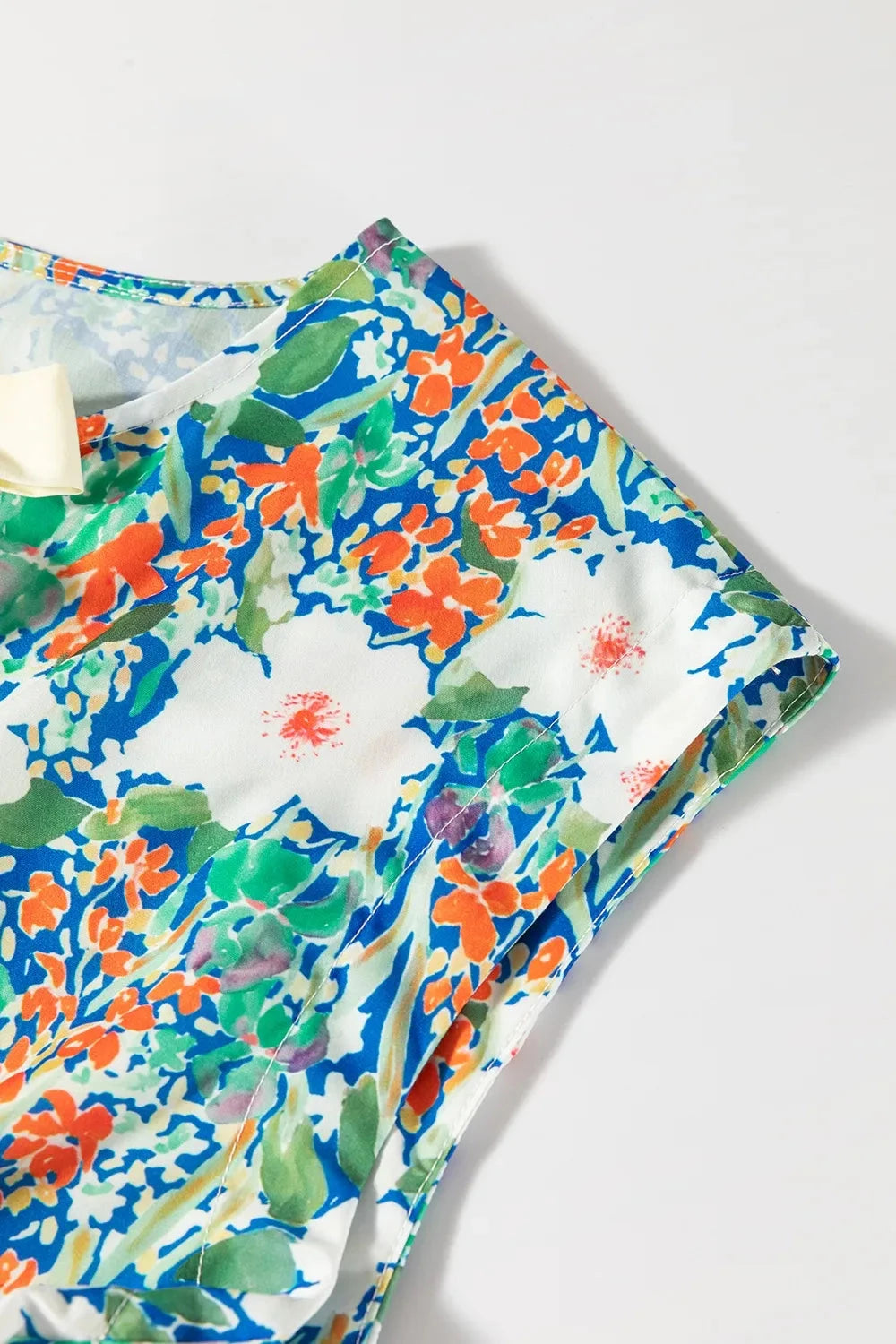 Floral Print Bow Applique Slit Sleeveless Peplum Blouse Simply Love