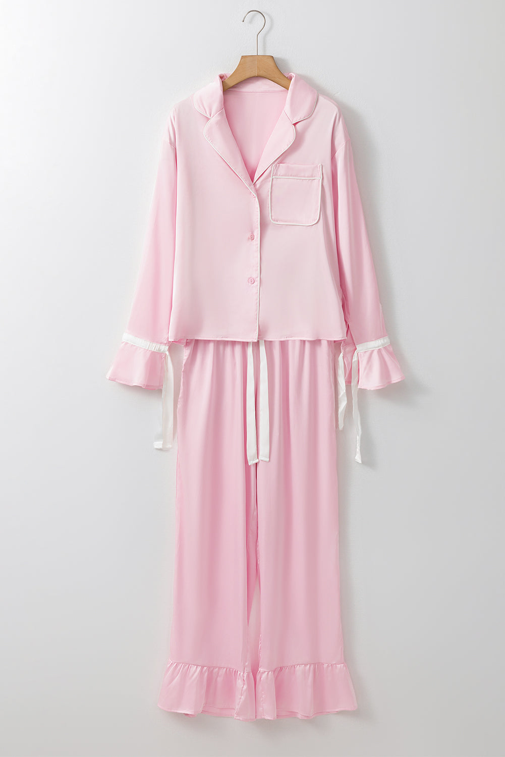 Elegant light pink satin lounge set with knot accent and ruffled pants