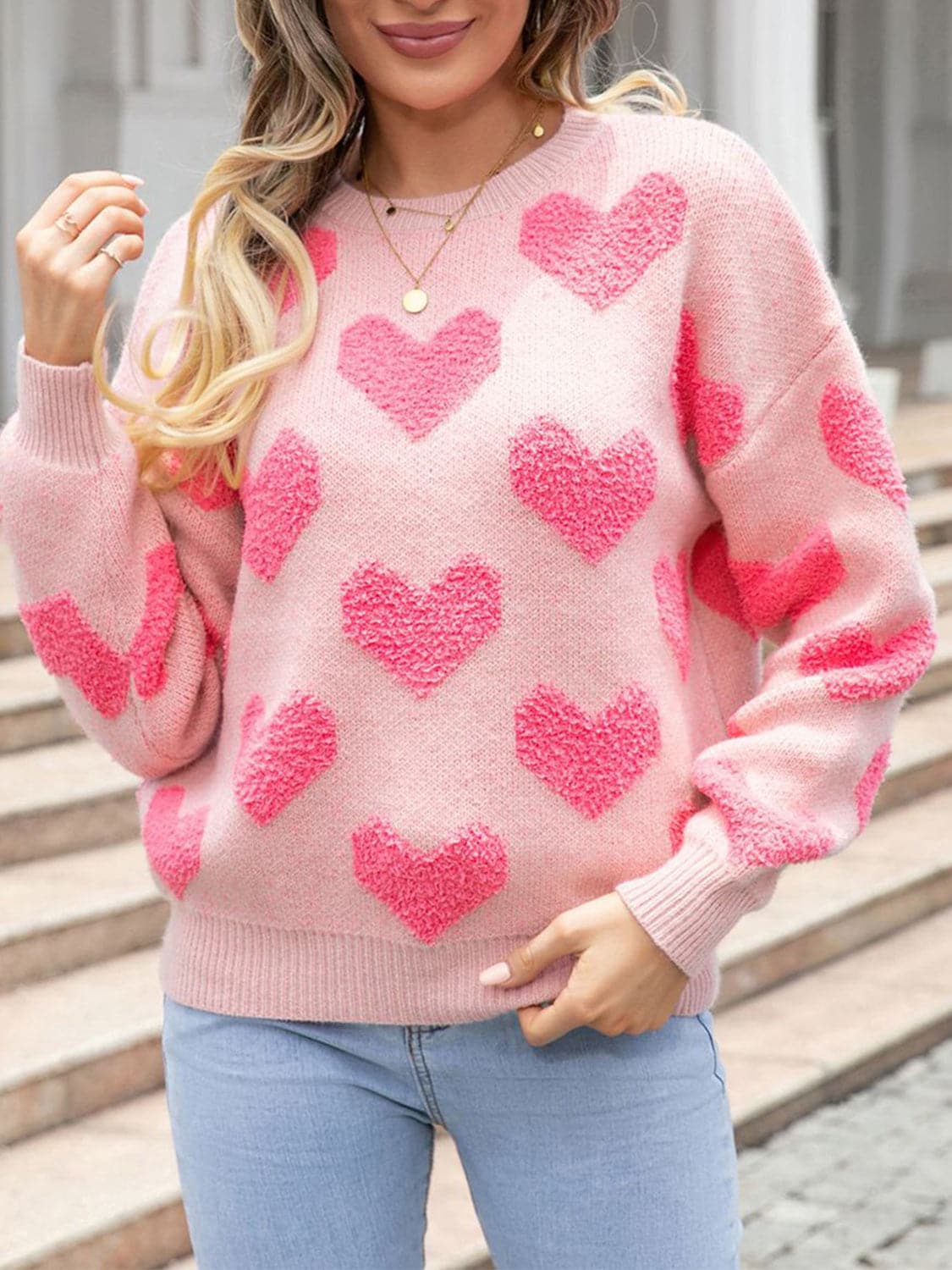 Cozy heart drop shoulder sweater with pink heart design and round neck