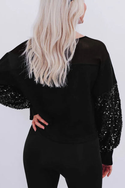 Glamorous sequined boat neck blouse with long sleeves