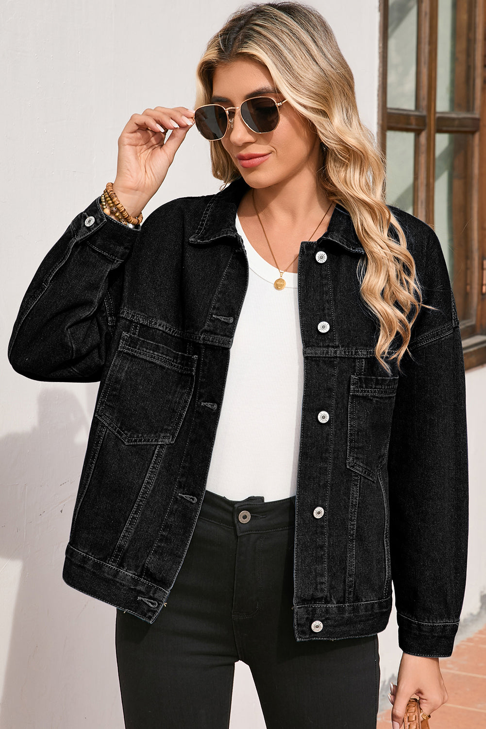 Back view of the Love Salve Women's Black Denim Jacket, emphasizing its comfortable oversized fit and versatile casual style.