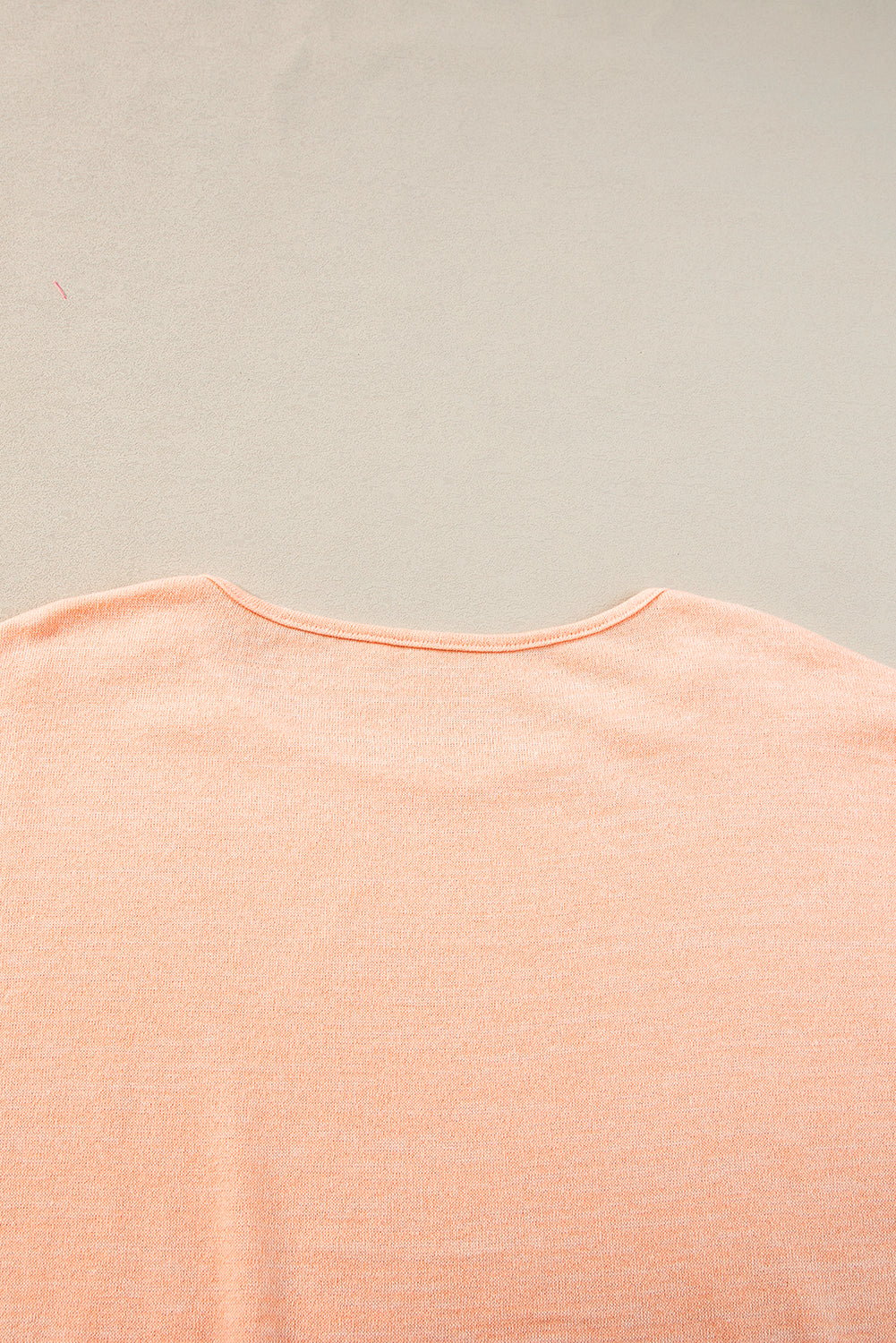 Chic apricot pink batwing sleeve tee with button accents