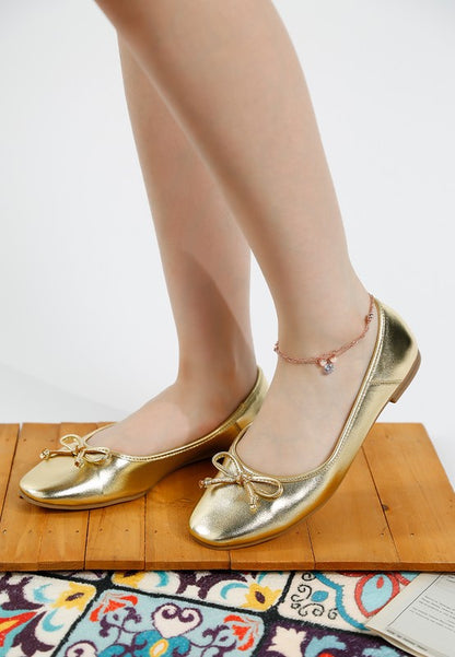 Metallic bow detail flats