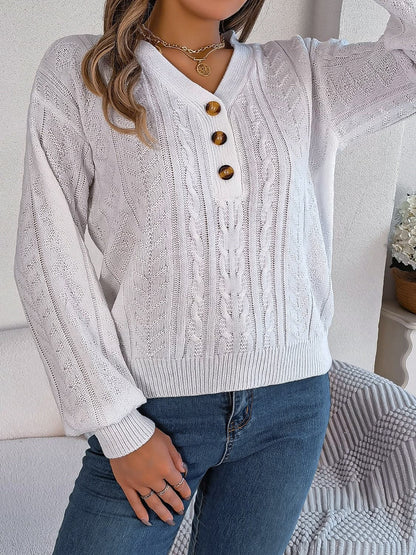 Chic cable-knit v-neck sweater with buttoned details