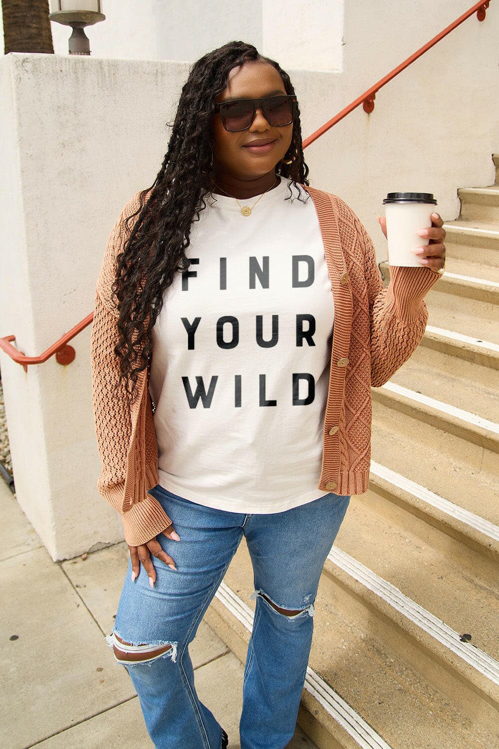 Wild adventure tee with 'Find Your Wild' message, styled with casual outfit.