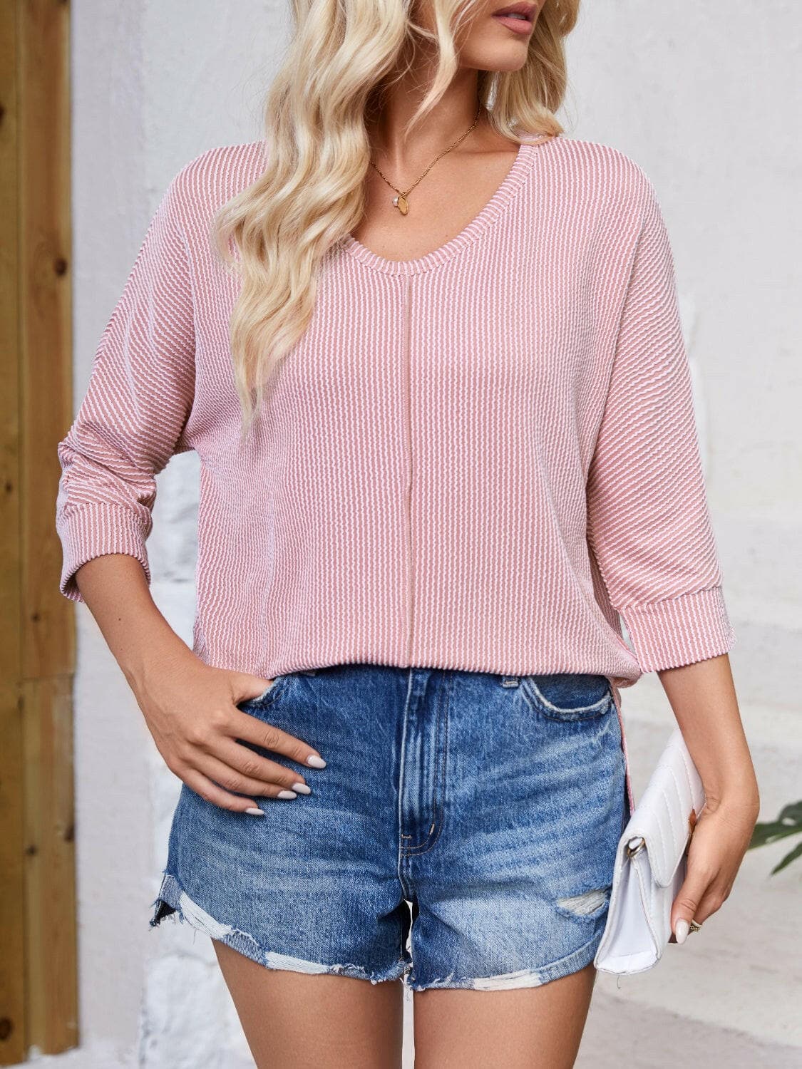 Textured Round Neck Three-Quarter Sleeve Blouse.