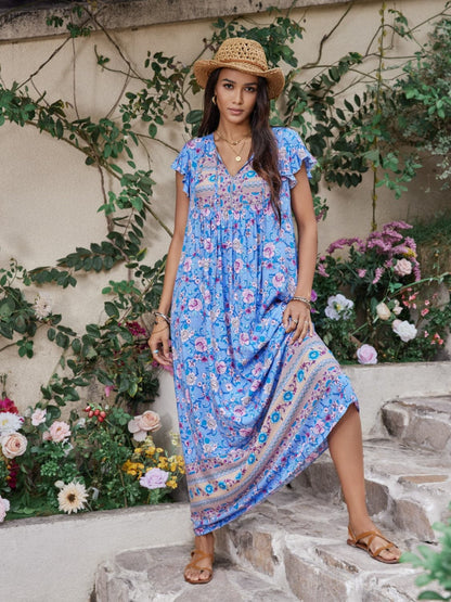 Ruffled Printed Tie Neck Cap Sleeve Dress.