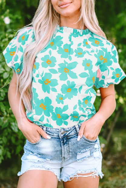 Chic green floral blouse with puff sleeves and frilled neckline