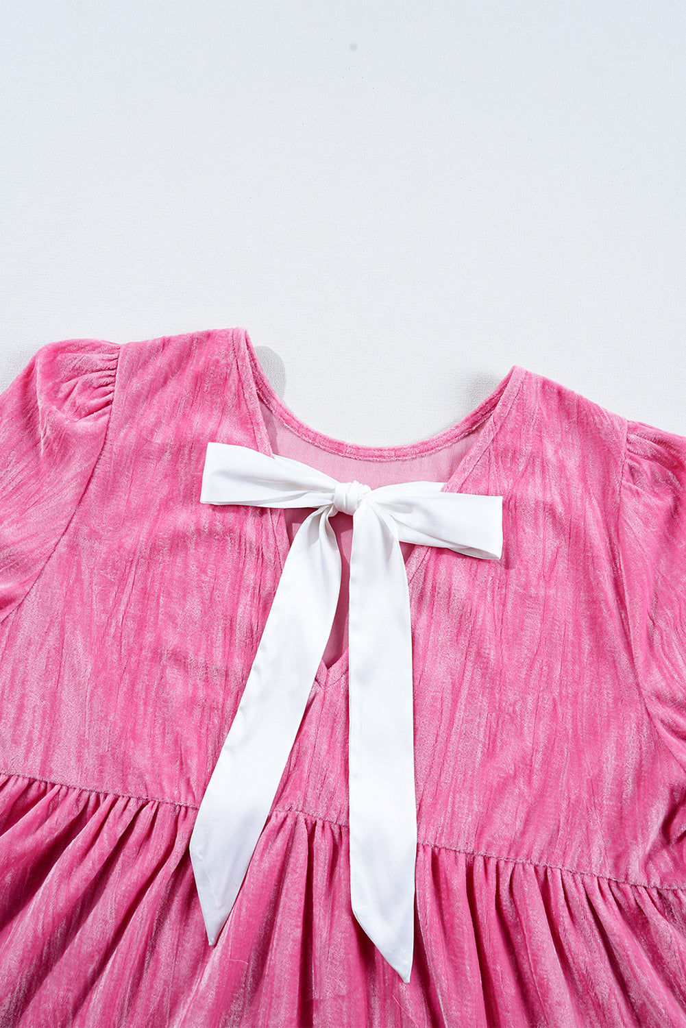 Playful strawberry pink velvet mini dress with flounce sleeves and tiered ruffles