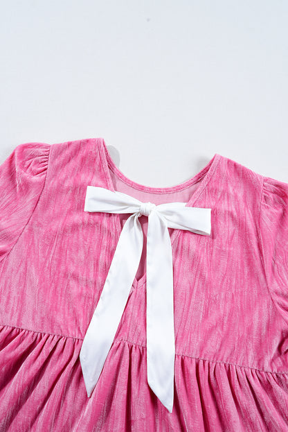 Playful strawberry pink velvet mini dress with flounce sleeves and tiered ruffles