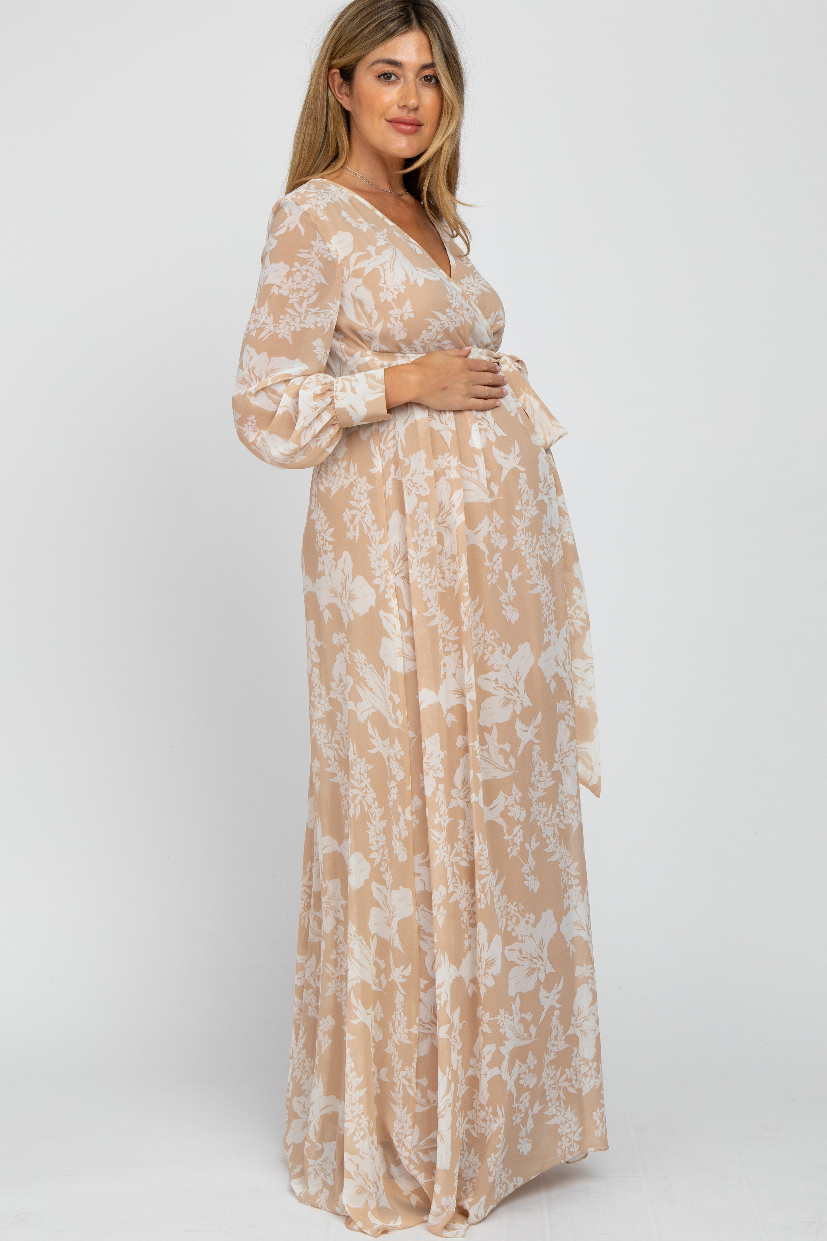 PinkBlush Taupe Floral Chiffon Maternity Maxi Dress, side profile showcasing flowing fabric and floral pattern.