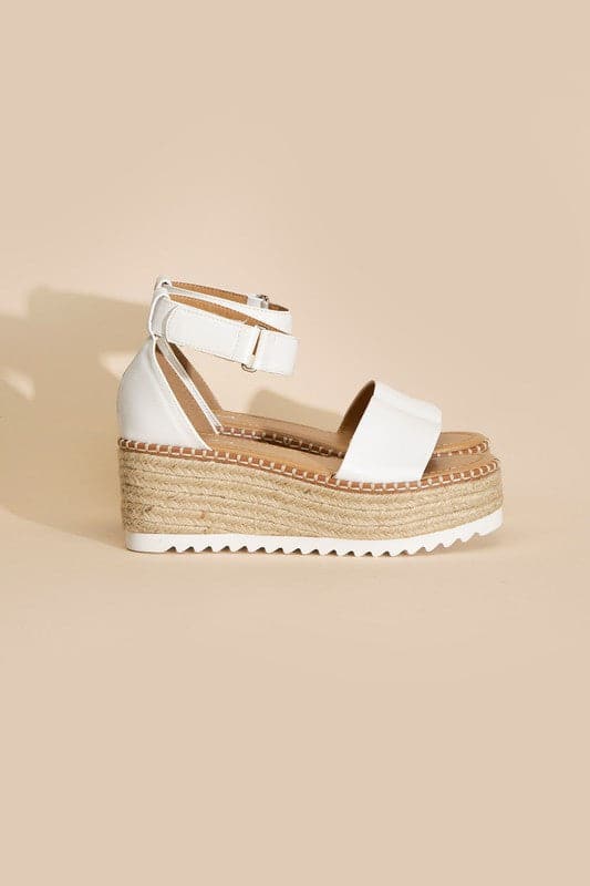 TUCKIN-S PLATFORM SANDALS.