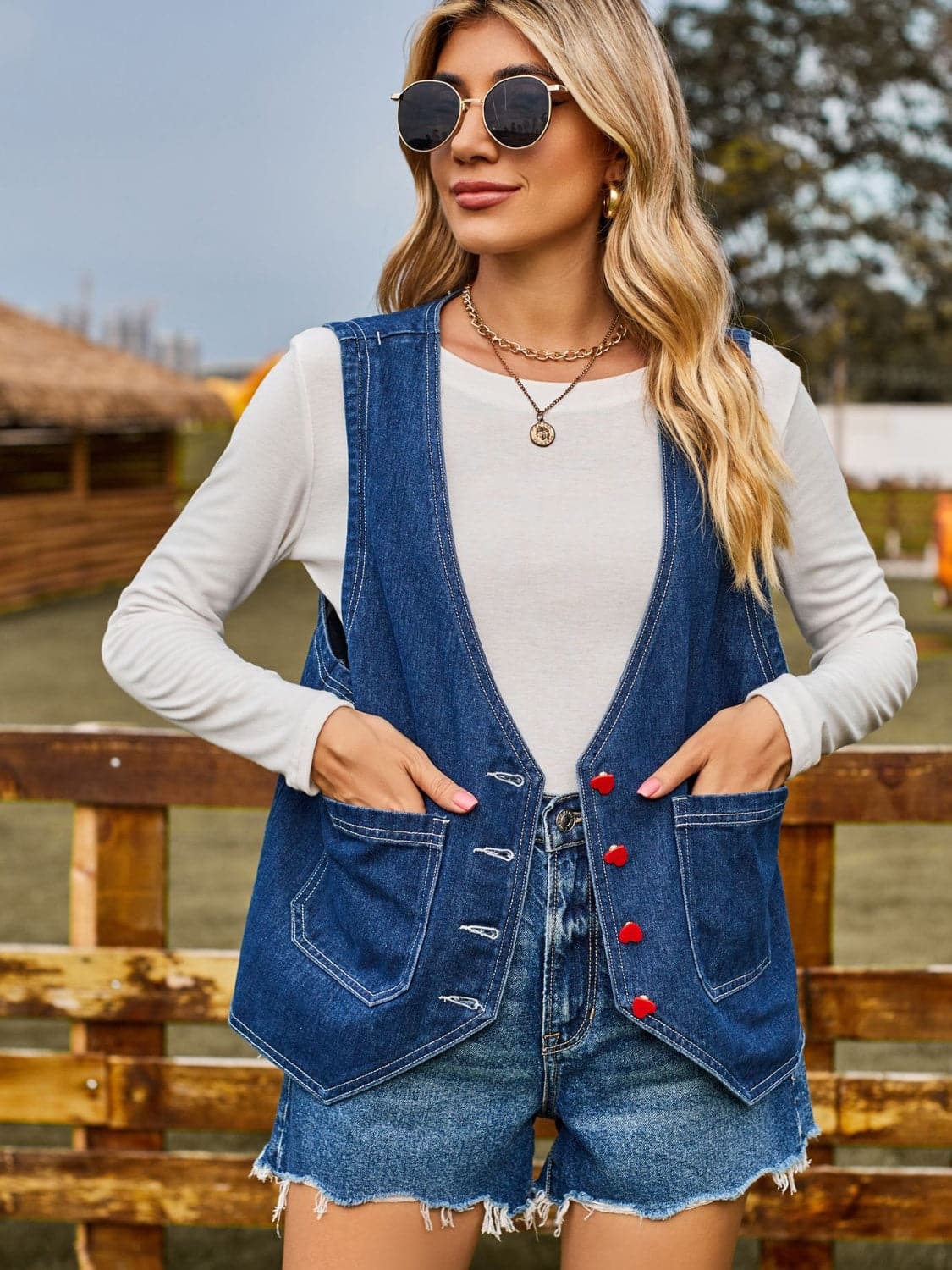 Pocketed Button Up Sleeveless Denim Jacket.