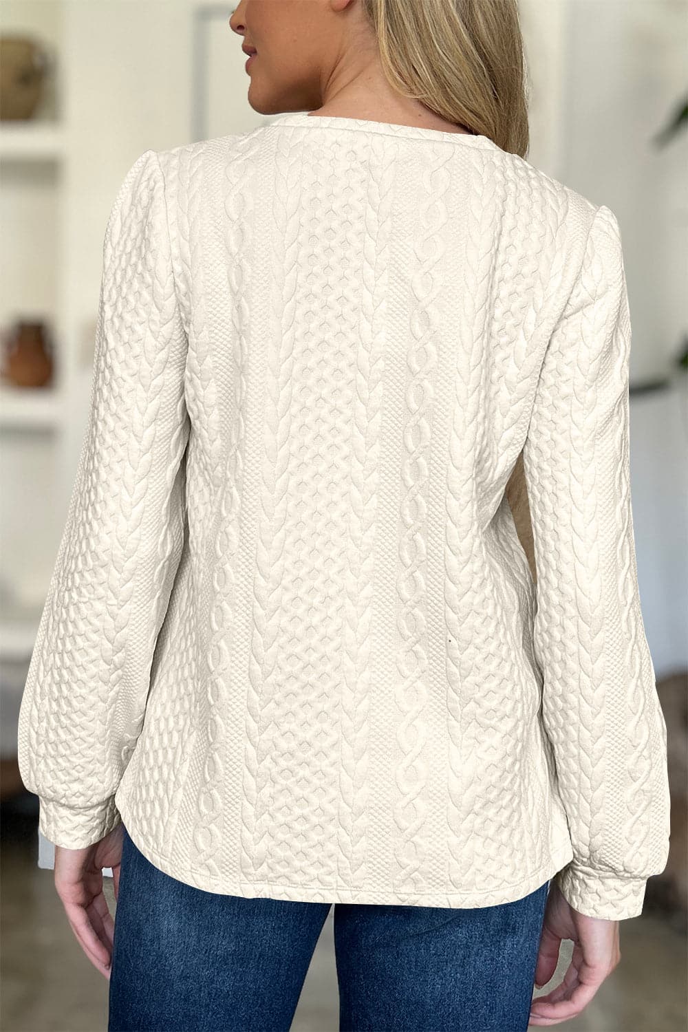 Textured Round Neck Long Sleeve Sweatshirt.