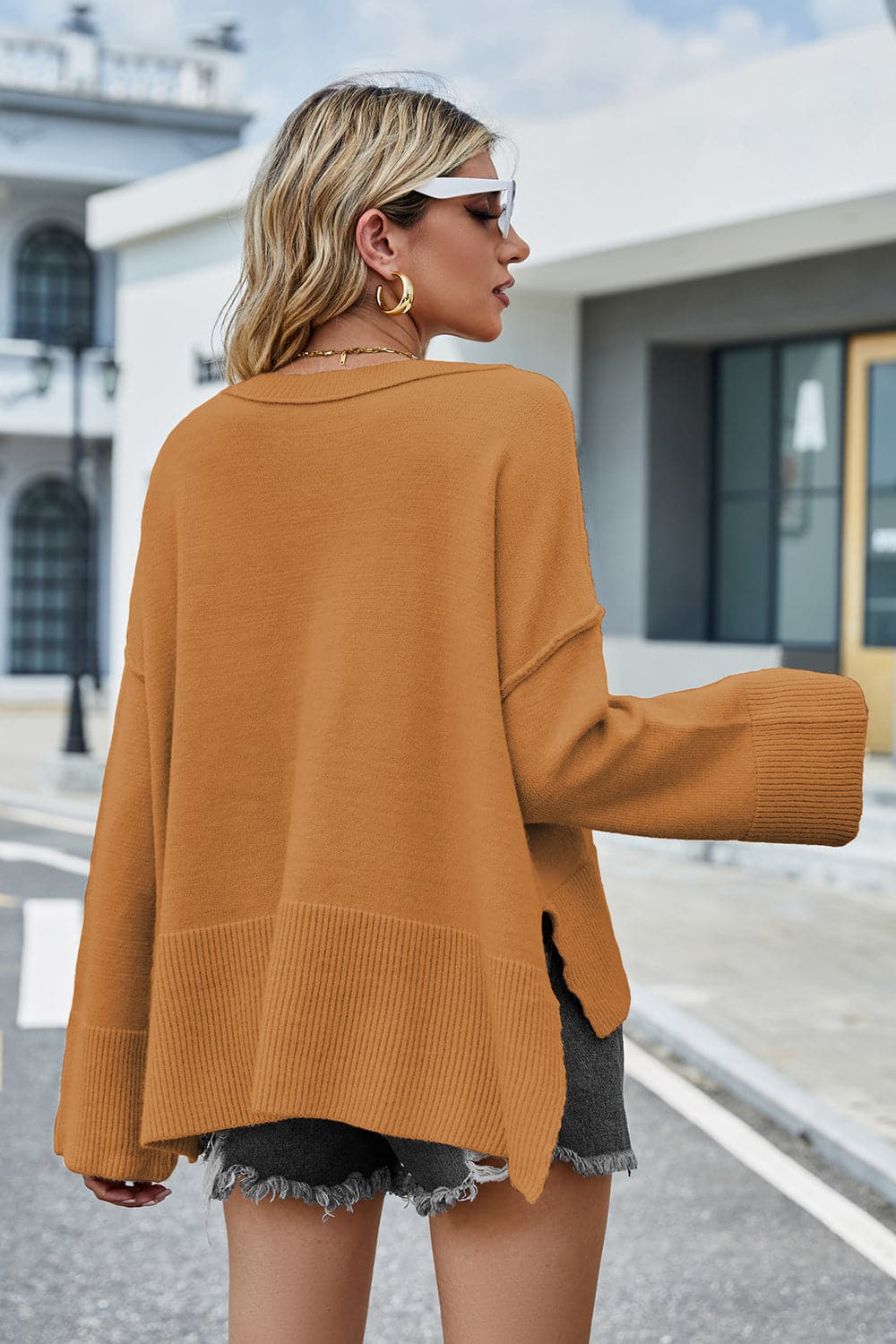 High-Low Slit Round Neck Long Sleeve Sweater.