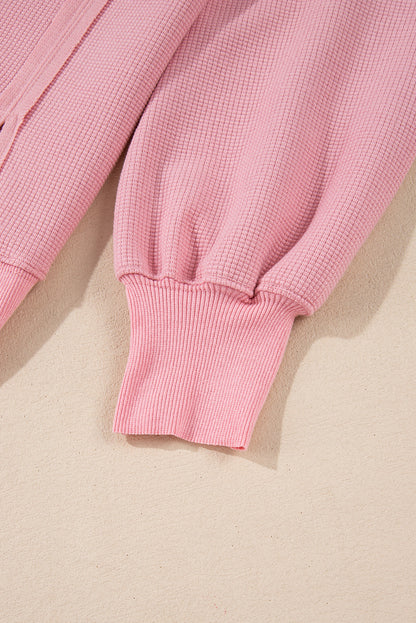 Cozy pink oversized sweatshirt with bishop sleeves and split detail