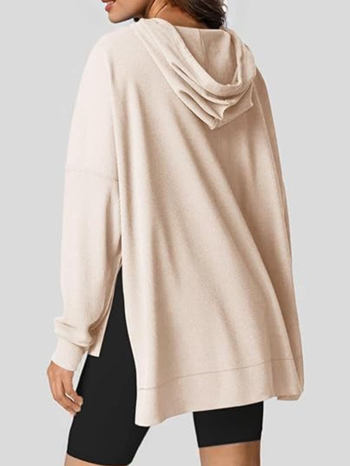 Sleek pocketed hoodie with drawstring and side slit