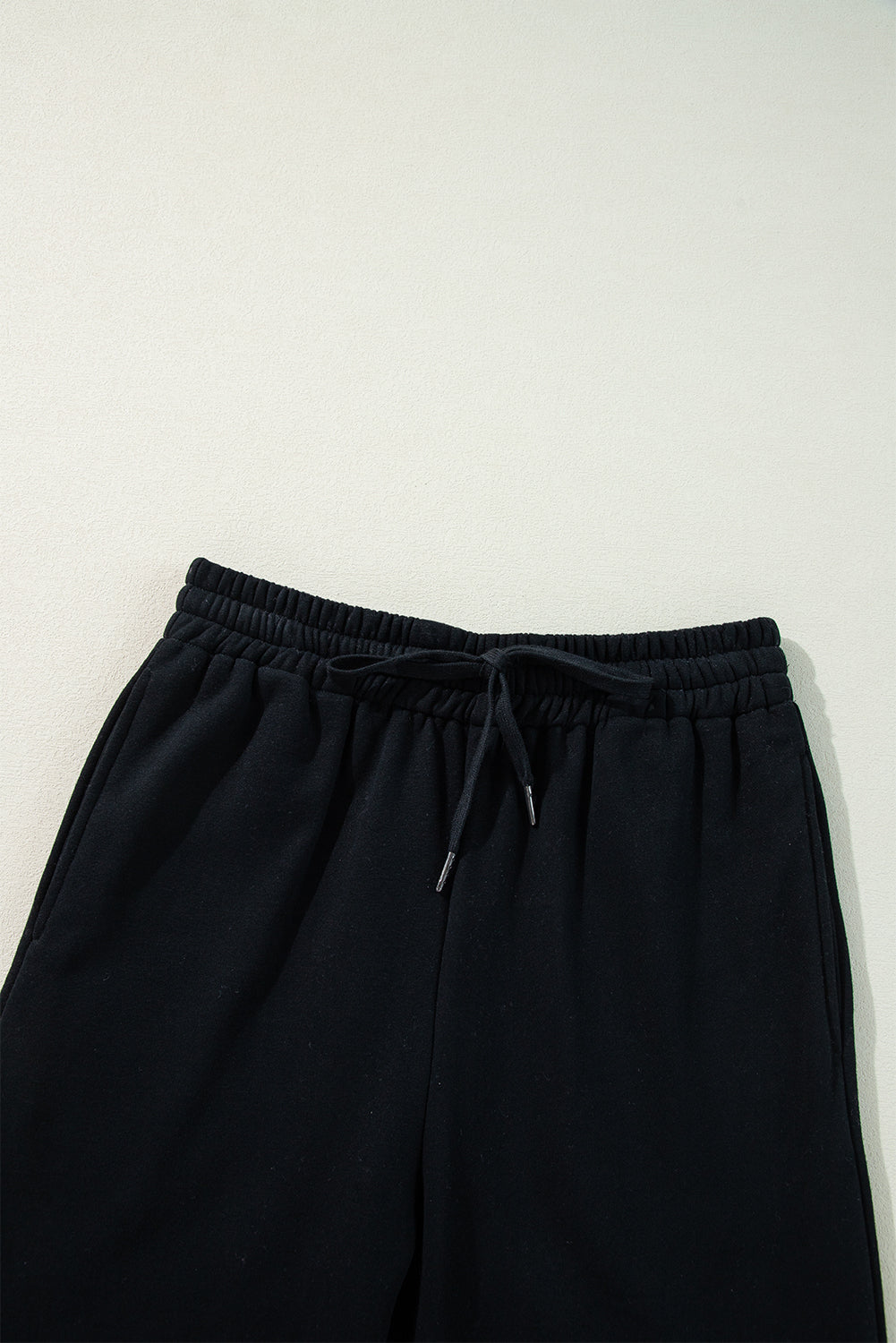 Cozy black fleece-lined casual pants with adjustable drawstring waist