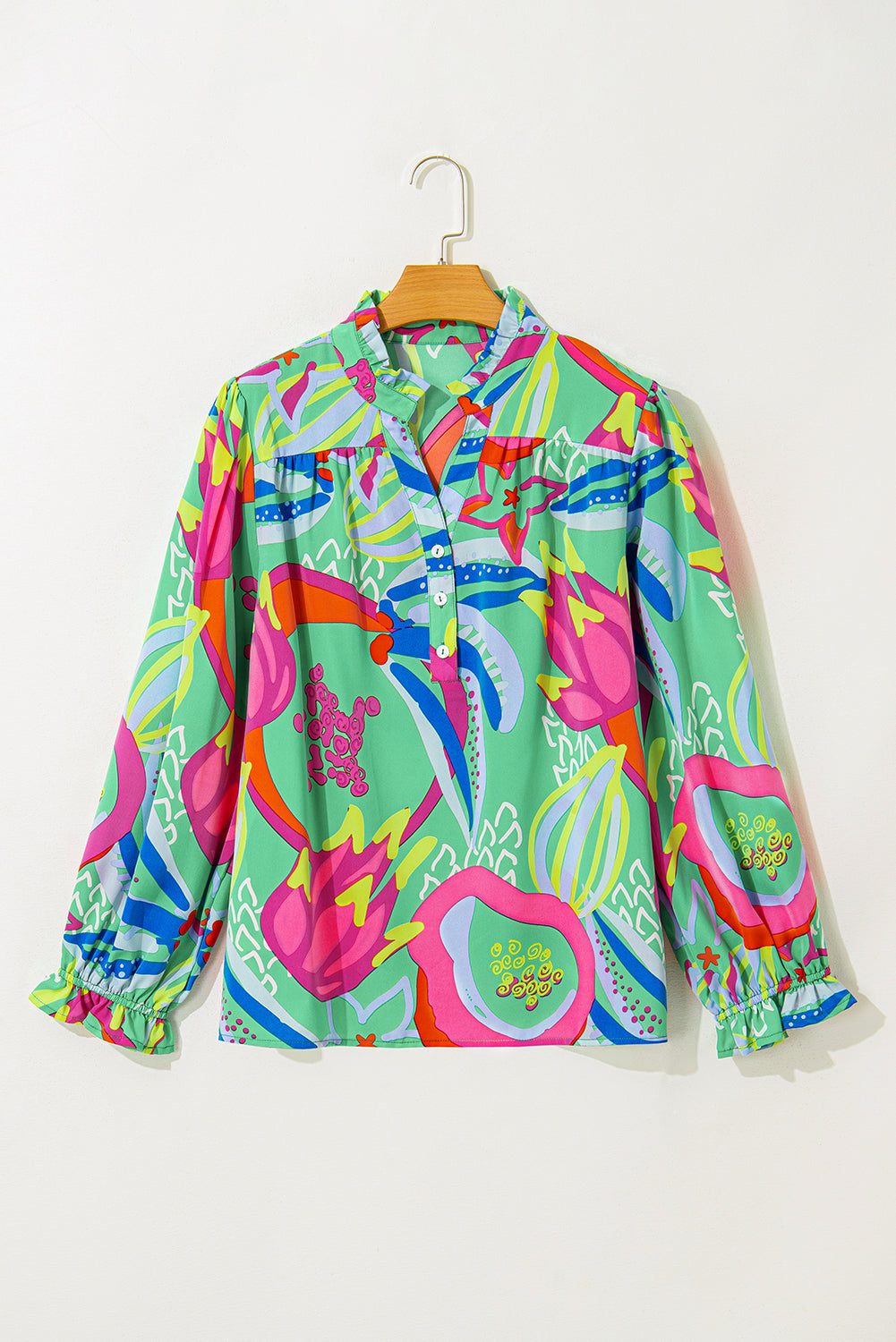 Plus size green abstract blouse with flounce sleeves and V-neckline.