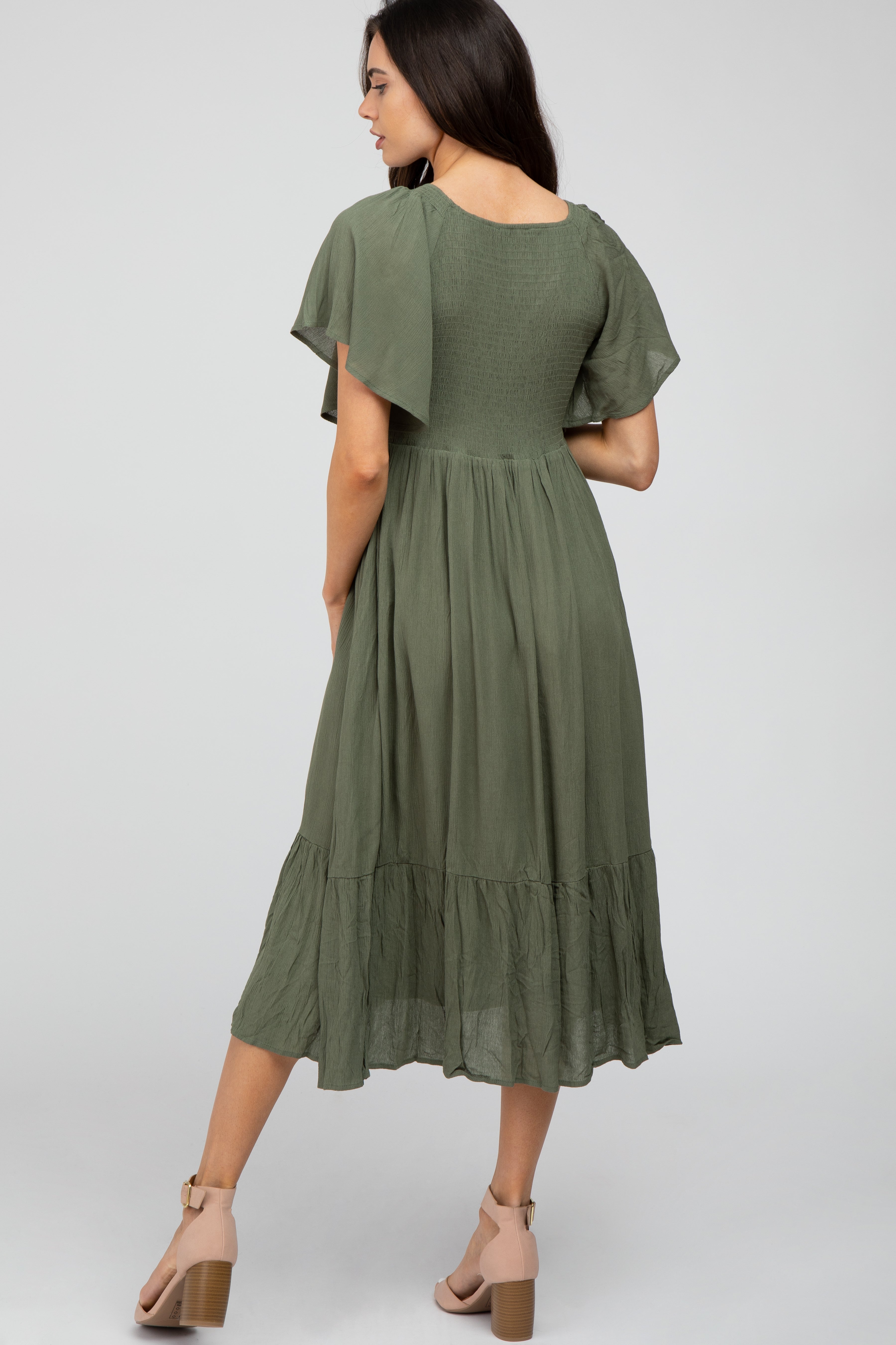 PinkBlush pregnant woman wearing olive ruffle maternity dress