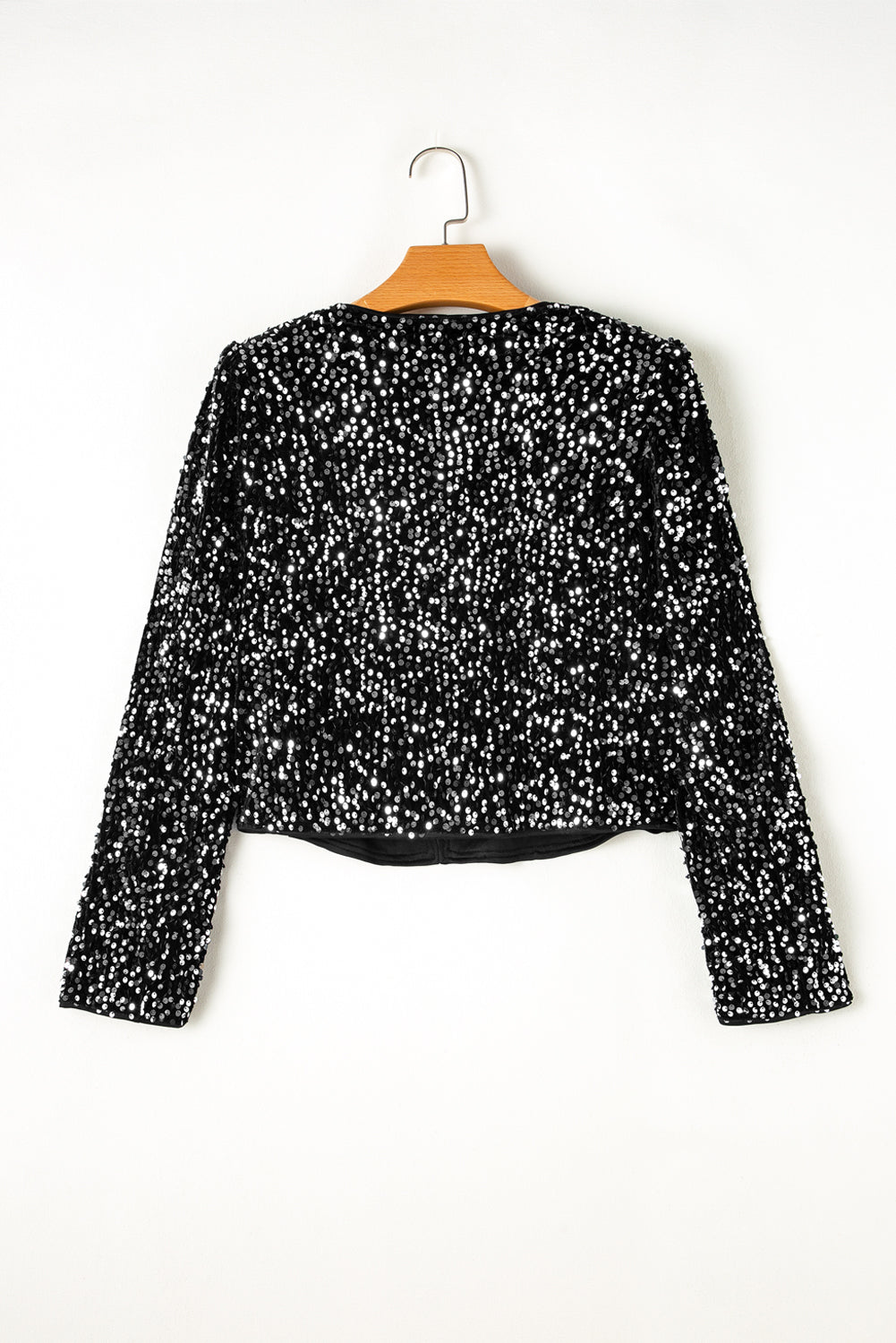 Sparkling black sequin cropped jacket with open front design