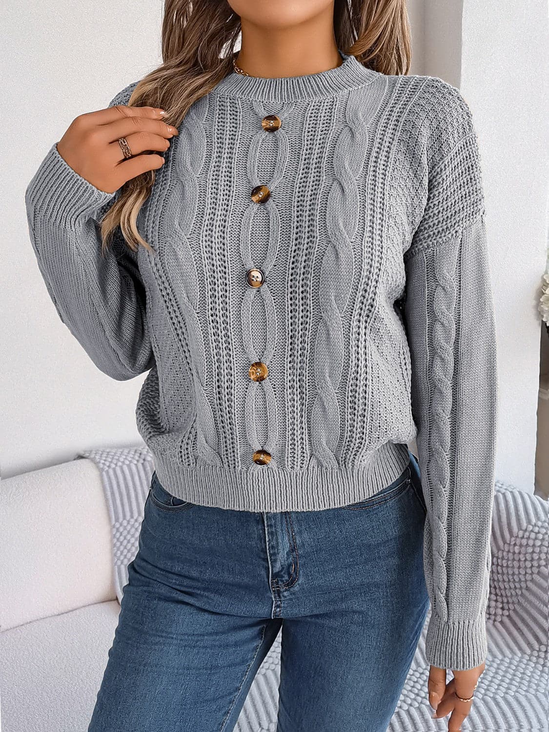 Cable-Knit Buttoned Round Neck Sweater.