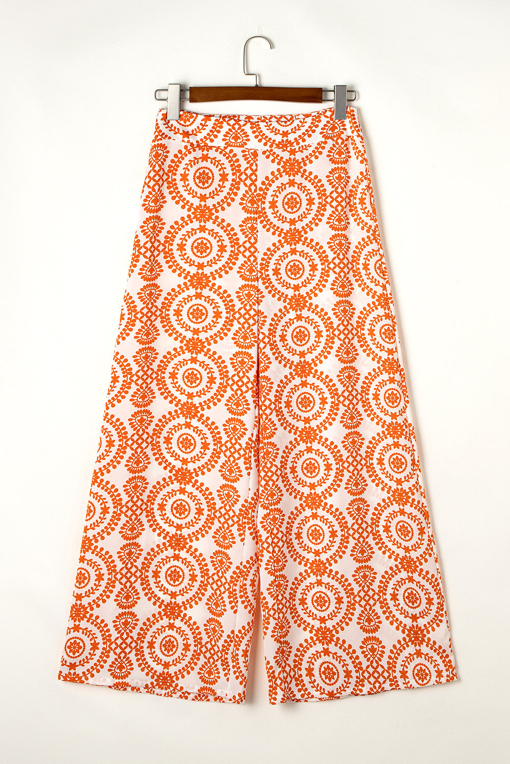 Chic orange bohemian wide leg pants with retro floral design