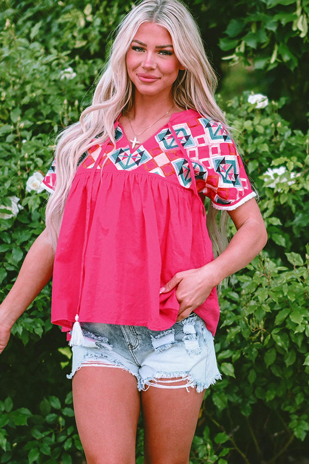 Chic strawberry pink geometric embroidered blouse with tassel tie neckline