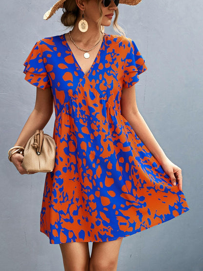 Ruffled Printed V-Neck Short Sleeve Mini DressUpgrade Your Wardrobe with our Ruffled Printed V-Neck Short Sleeve Mini Dress
 Step out in style with our stunning Ruffled Printed V-Neck Short Sleeve Mini Dress. ElLove Salve -Neck Short Sleeve Mini Dress